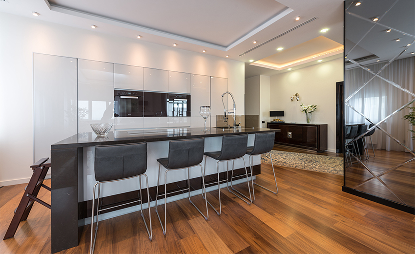 Studio apartment with modern kitchen zone and suspended ceiling