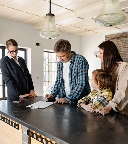 A Man Signing a Document with Their Real Estate Agent